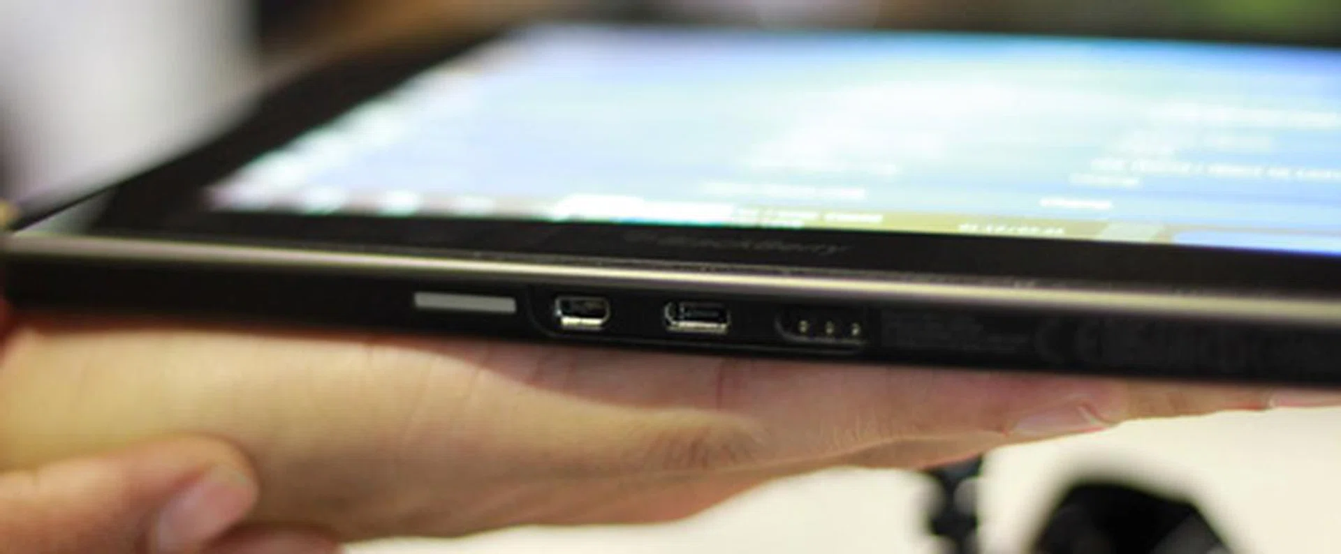 From left to right: mini HDMI port (for video output to bigger screens), microUSB port (which can also be used to charge the PlayBook), and the magnetic charge connector much like Apple's MagSafe design.