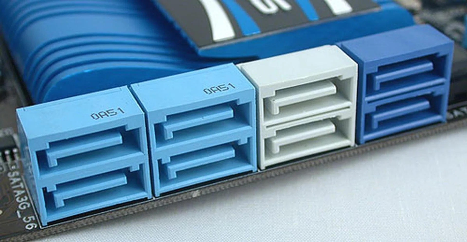 Besides the four light blue SATA 3Gbps ports from the P67 chipset, the two gray ones here are SATA 6Gbps ports from the same chipset and the darker, navy blue SATA ports are 6Gbps ones from the additional Marvell controller.