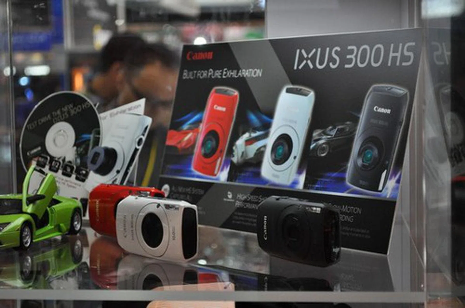 Canon's newest compact camera the IXUS 300 HS is on sale at the PC Show, going for $599. It shoots at its widest a cool F2.0 and looks terrific.