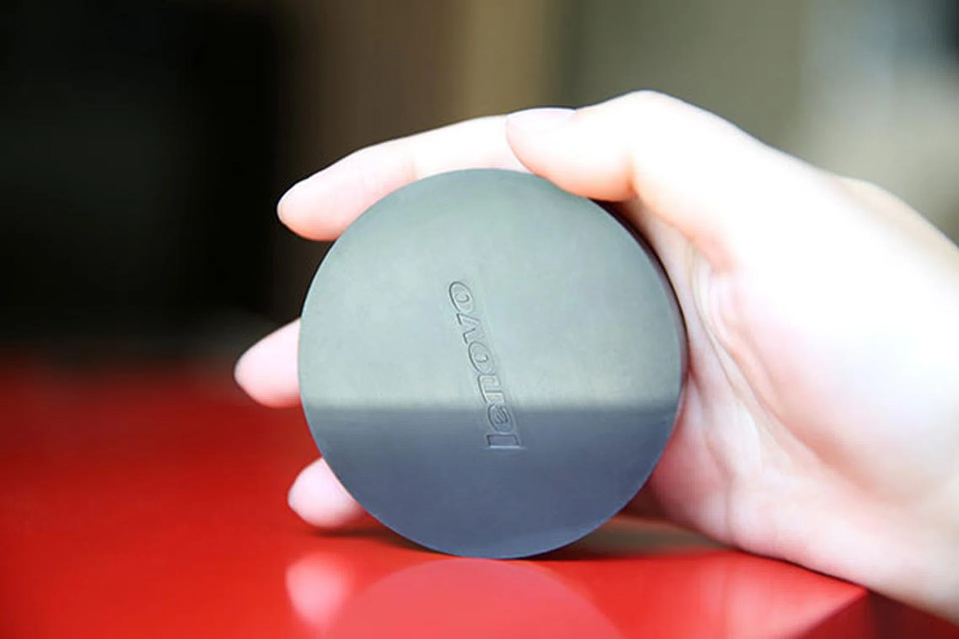 The Lenovo Cast is a portable, palm-sized device that weighs just 50g. (Image Source: Lenovo)