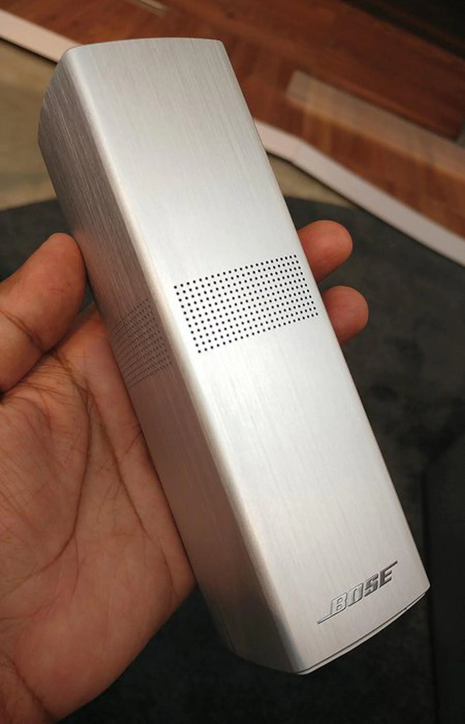 The new OmniJewel satellites are the smallest speakers Bose has ever designed. They are also very light. Notice the perforated holes that allow for 360-degree audio.