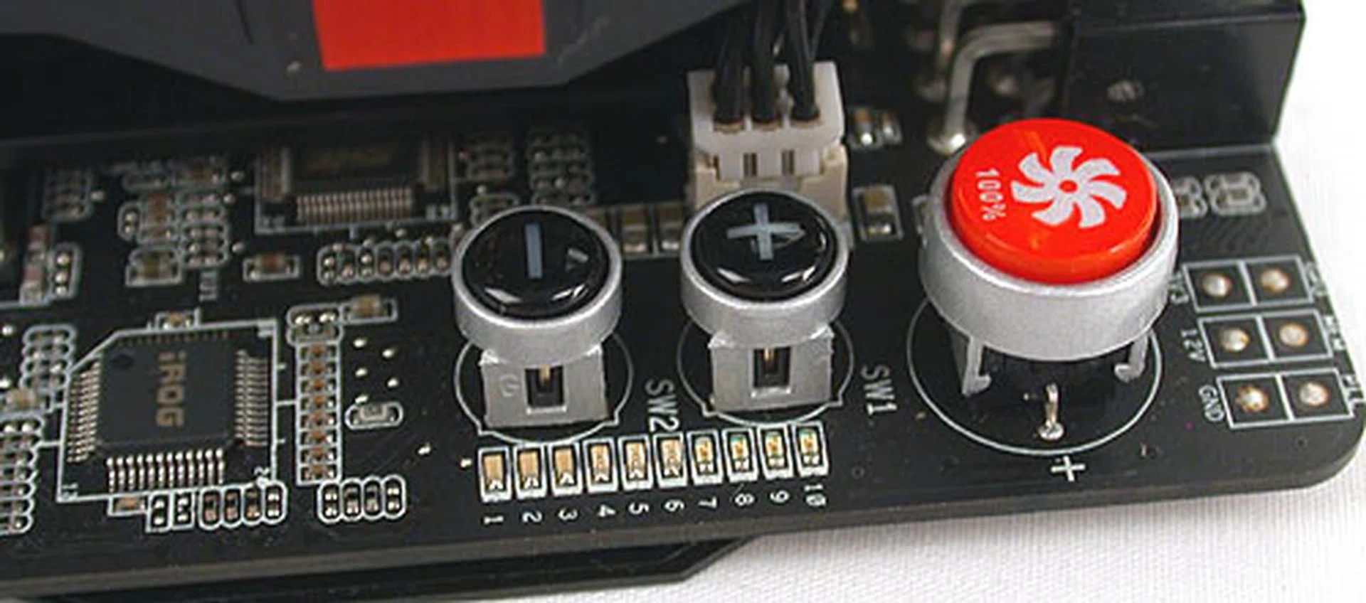 If you need a quick fix for your cooling issues, just press the red button. It instantly pushes the fan speed to 100%, which is pretty loud. The other two buttons, the plus and minus allows users to adjust the core voltage directly, without going through any software utility. 