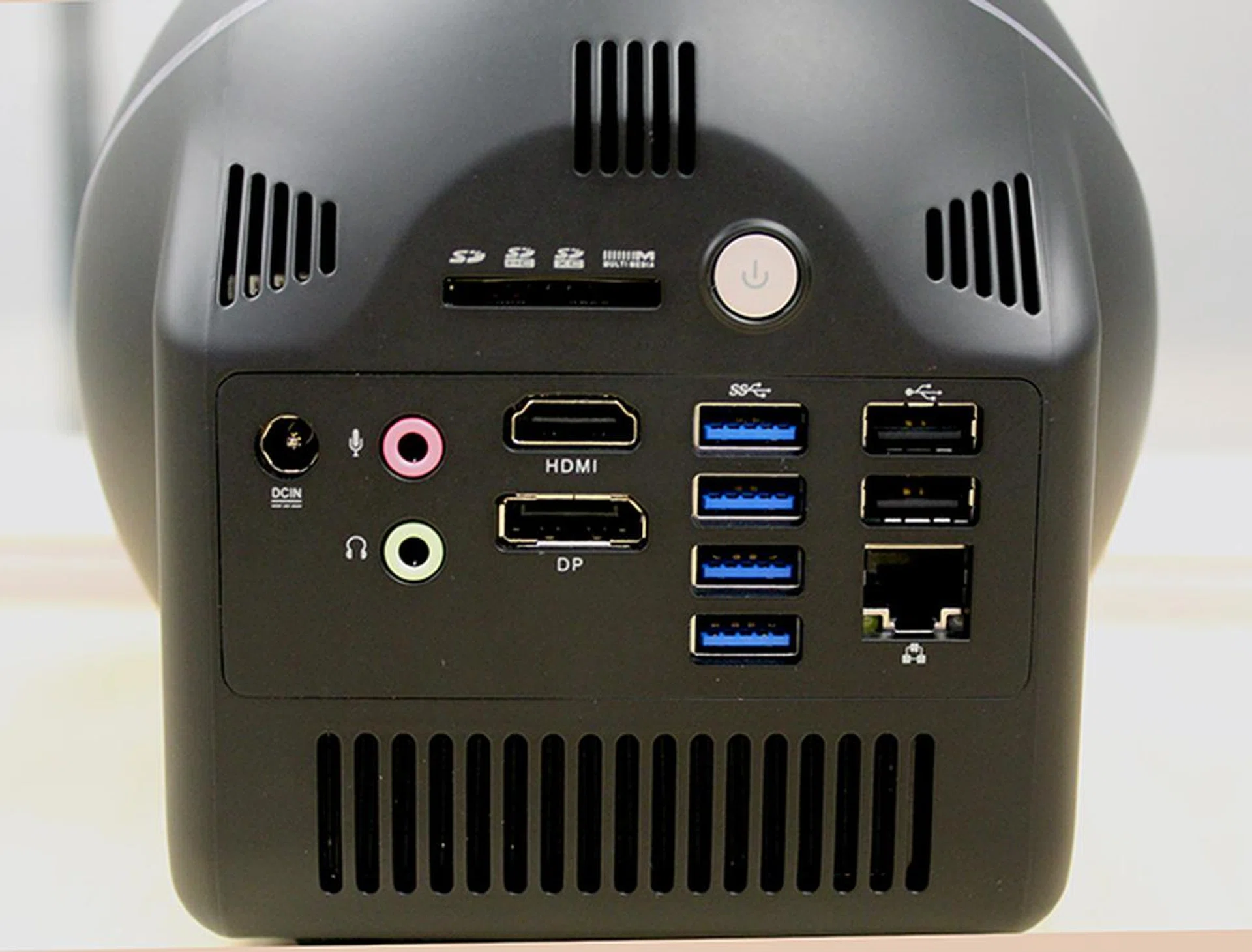 Despite its compact size, the ZBOX Sphere OI520 has just about all the ports you would want or need. An additional USB 2.0 port is hidden to the left and out of view.