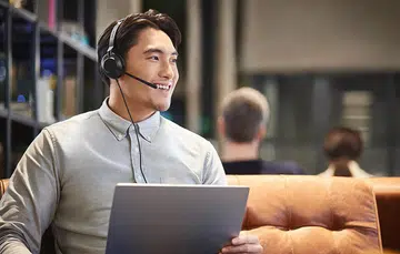 Jabra Evolve2 30 on the guy's head, in case you're wondering.