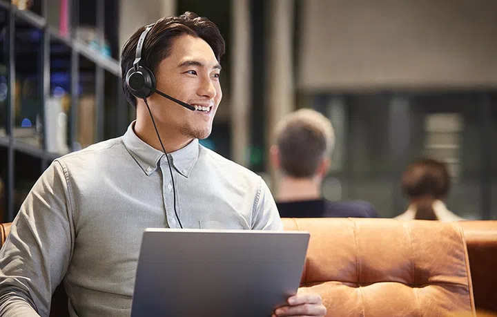 Jabra Evolve2 30 on the guy's head, in case you're wondering.