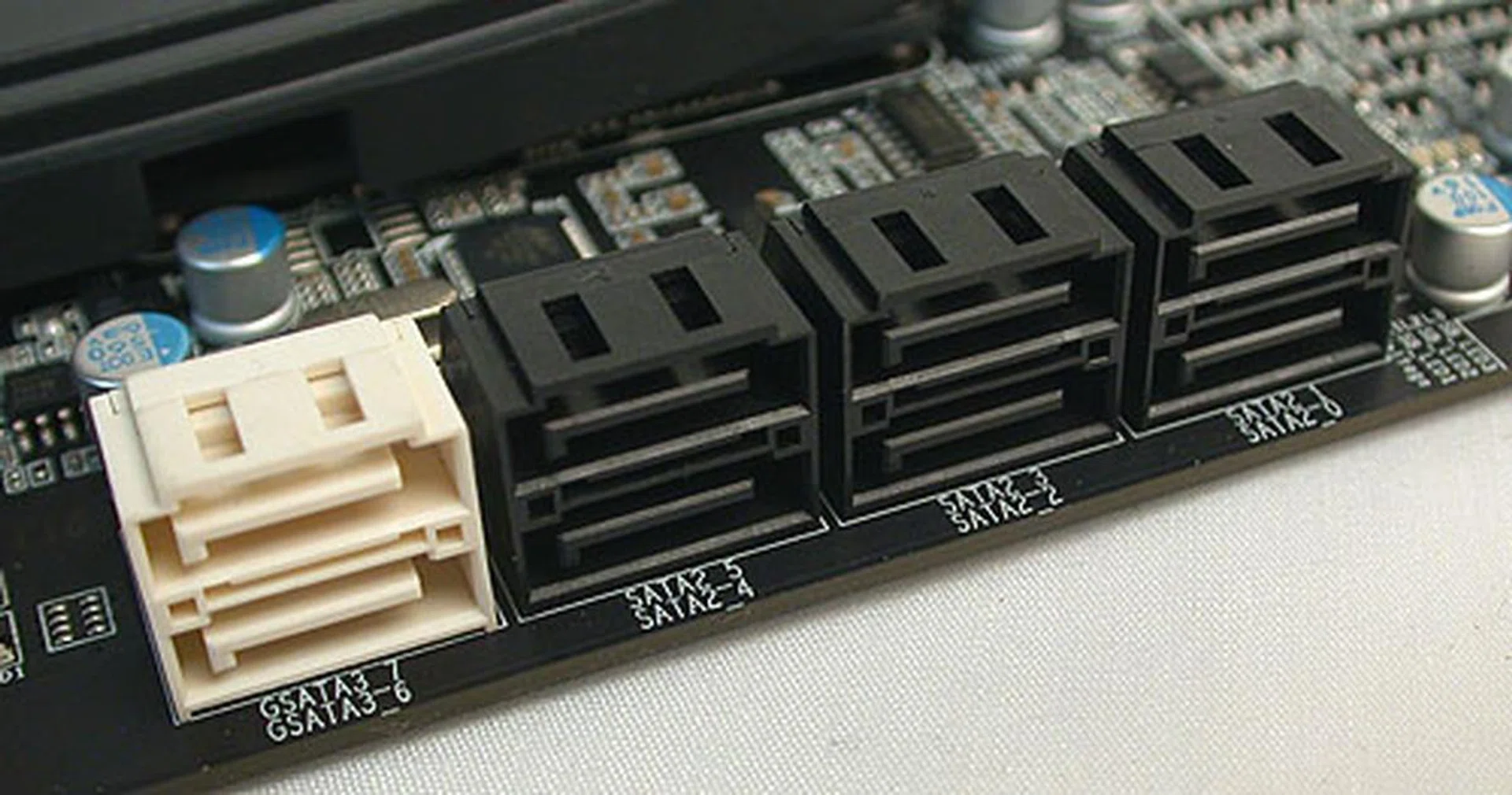With all the fuss surrounding Intel's Sandy Bridge motherboard recall issue, the X58 is blissfully unaffected. The six black SATA 3Gbps ports are from the ICH10R Southbridge and Gigabyte has added to them with two SATA 6Gbps ports from a Marvell 88SE9182 chip.
