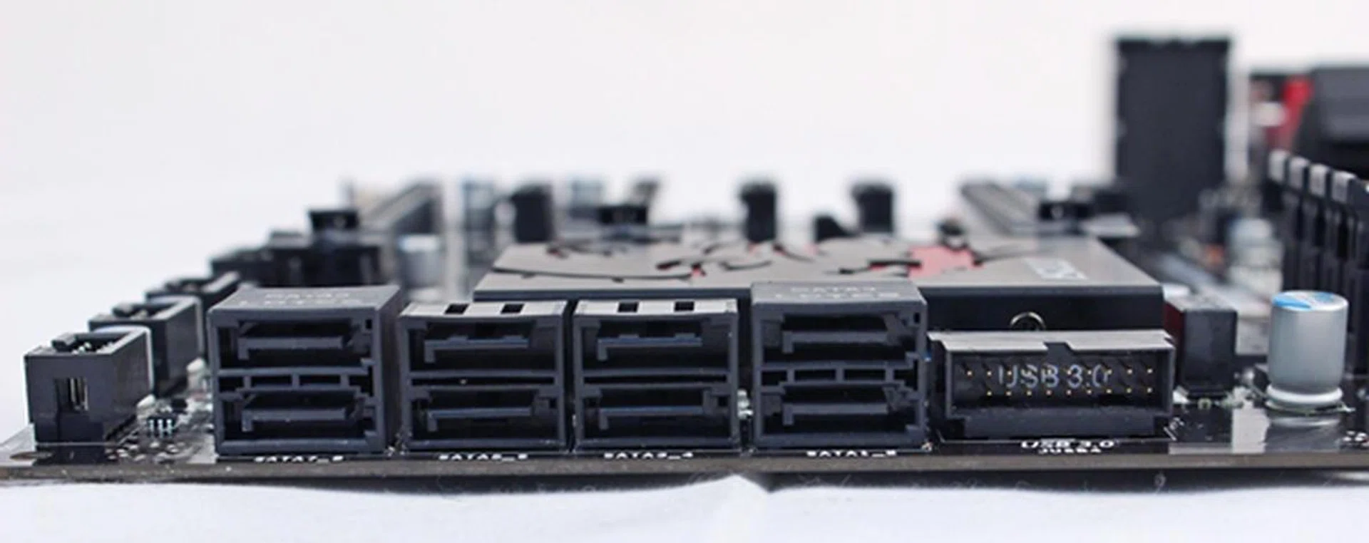 The rightmost SATA 6Gbps connector stack is driven by the board's Intel Z77 chipset; while the leftmost stack is powered by the Asmedia ASM1061 controller.