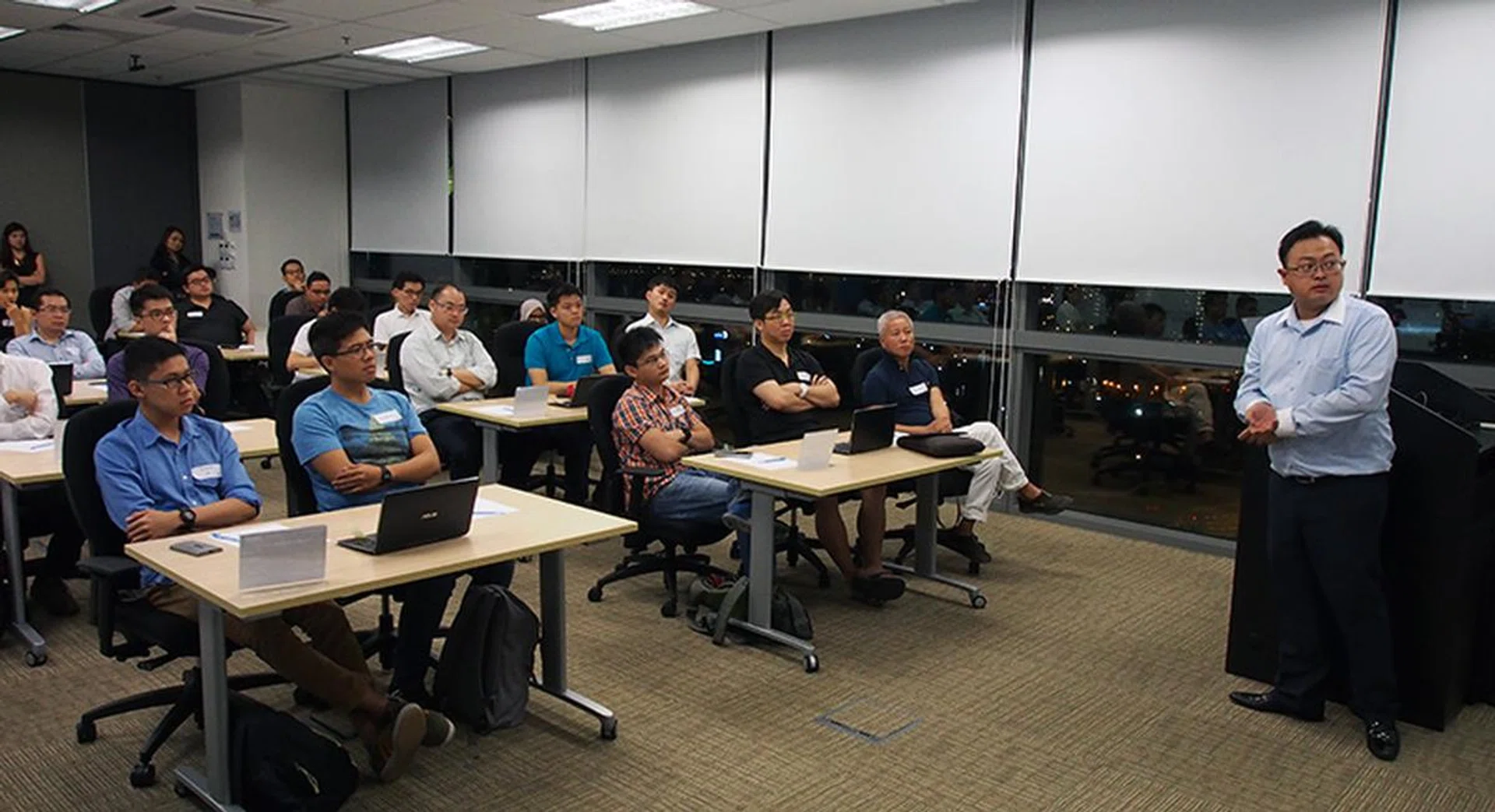 Participants paying close attention to Junjie's presentation.
