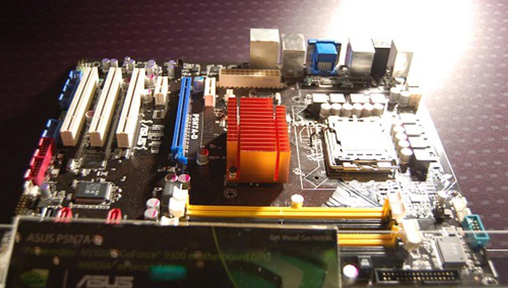 Here's the ASUS P5N7A-D, a full ATX board. The power connector is in a very old-school location, which is not a plus point.