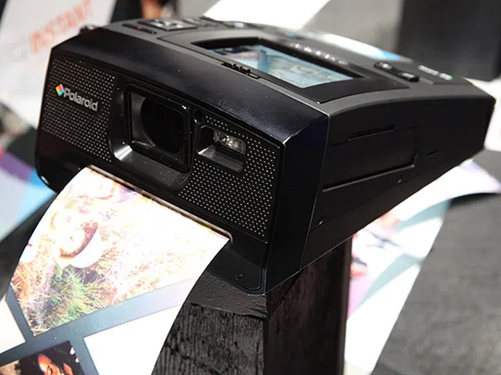 The Polaroid Z340 even sends prints out from the front, just like how it's done in the analog days.