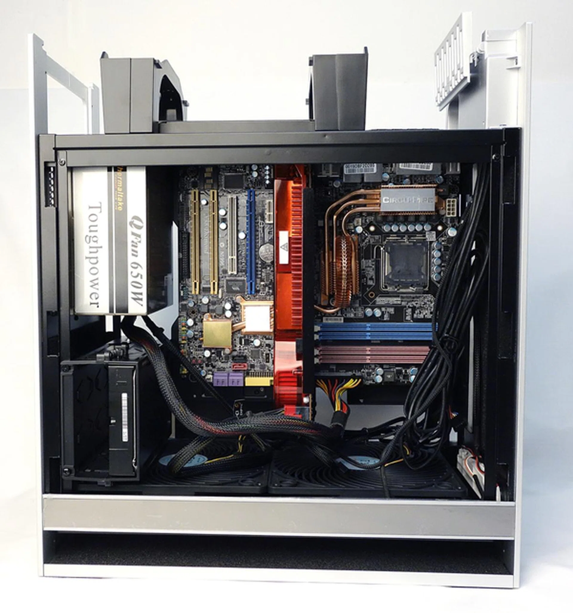 Our PSU was actually held in place vertically by only four mounting screws without any rest plate that you normally encounter. Our motherboard was also installed vertically. Also take note that you could route the cables to the back to give it a cleaner look.