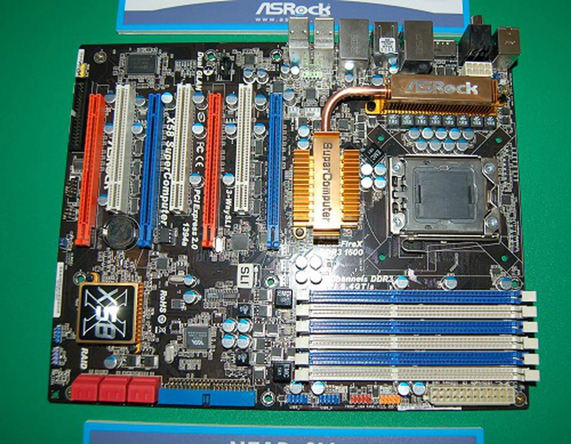  ASRock is getting more aggressive these days by keeping up with times and introducing motherboards based on the latest chipsets. Take for example; this board here is the X58 SuperComputer. With four PEG slots supporting Quad SLI and Quad CrossFireX, dual Gigabit LAN with teaming functionality and supporting DDR3 ECC buffered memory, ASRock is not only aiming high but is also aiming at the workstation market with their marketing tactics as it supports single-socket Xeon 3500 processors. With one less Gigabit LAN controller and some marketing fluff, ASRock has the X58 Deluxe motherboard for the rest of us consumers.  