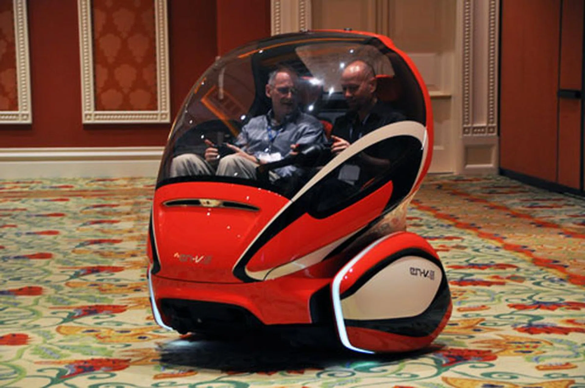 GM's EN-V concept car is freaking cool. Uses lithium-ion batteries and produces zero emission (though this is not counting the electric power plant that generates the electricity to charge the car).