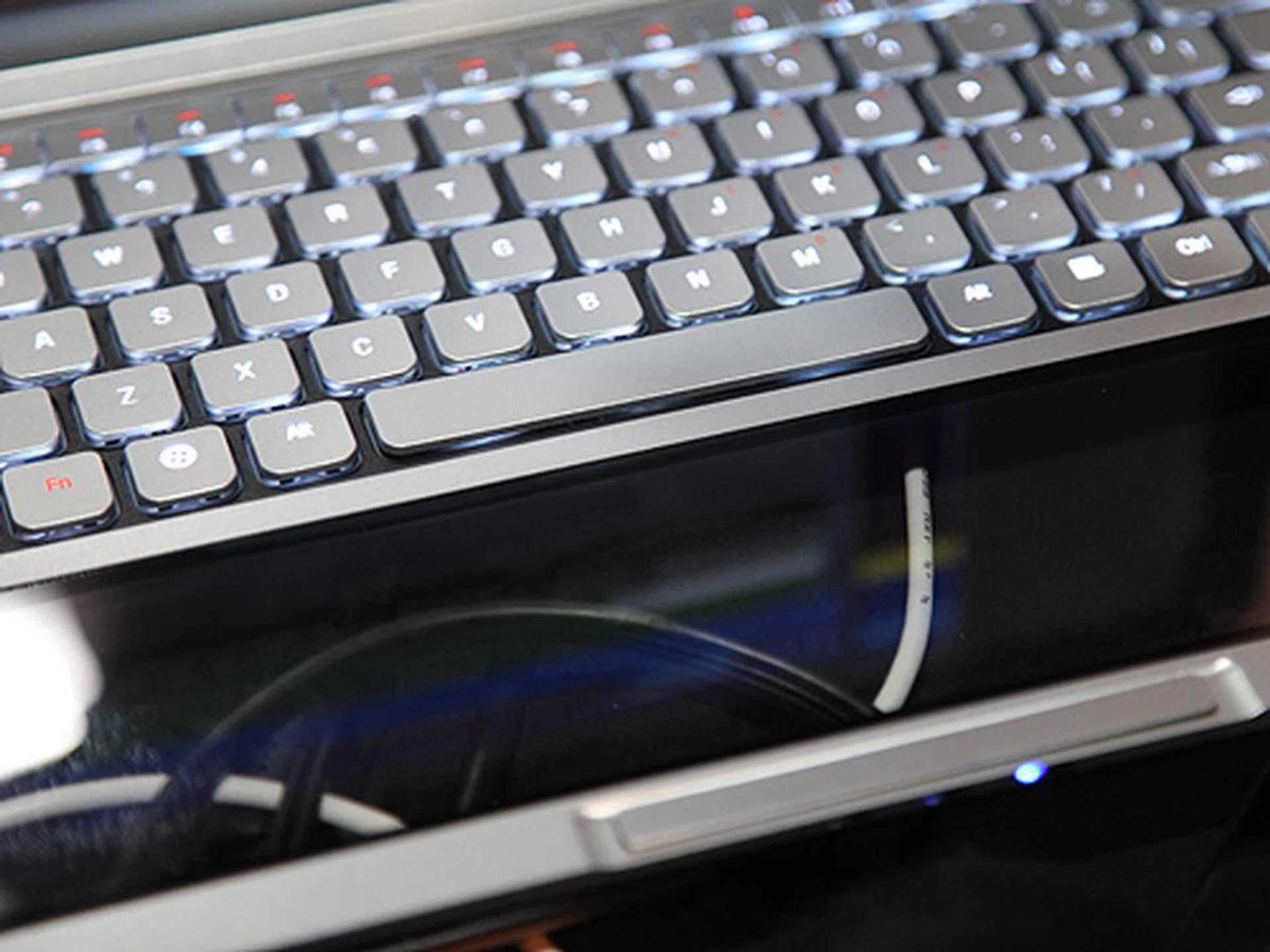 A closer look at the transparent touch panel below the keyboard.