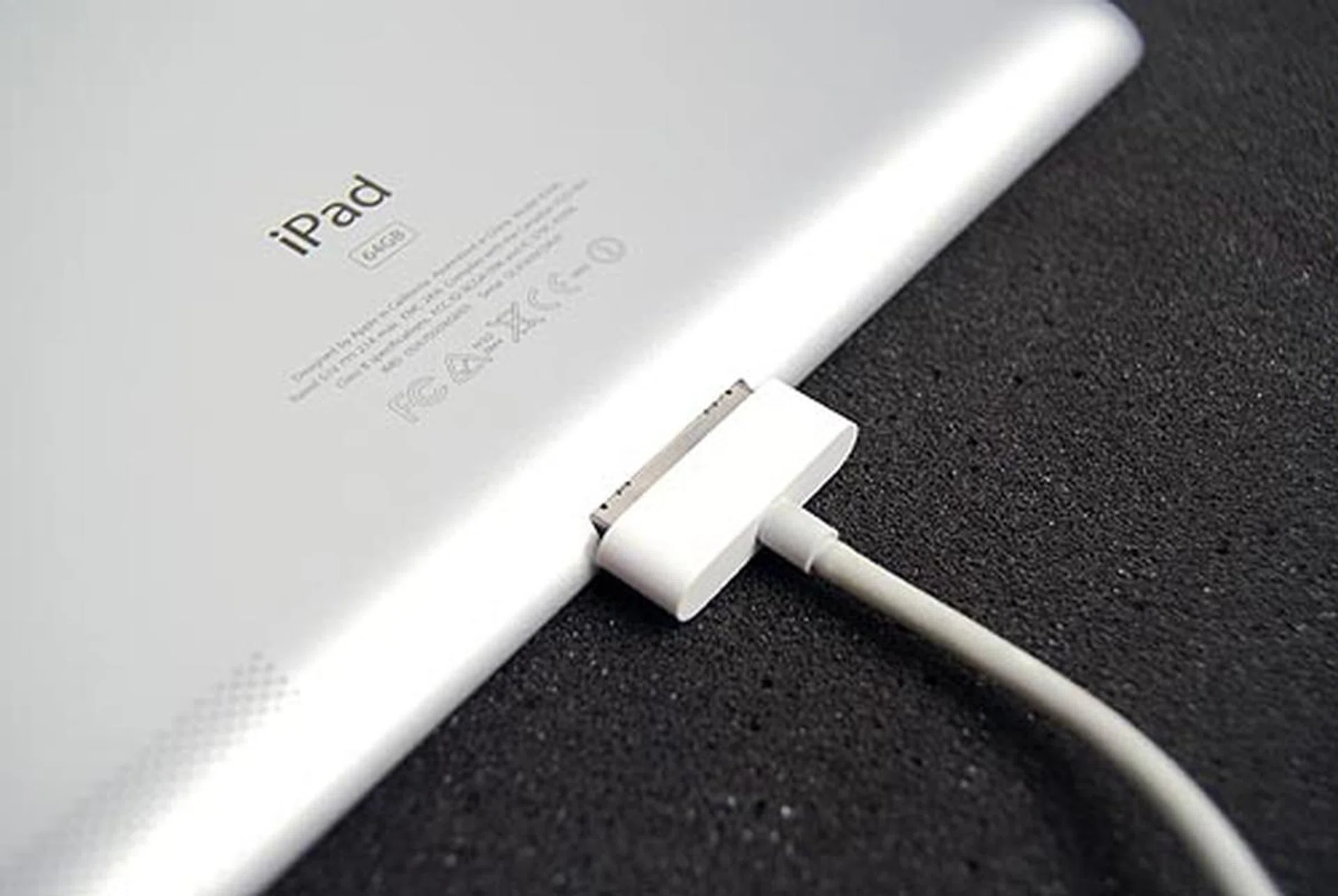 The dock connector sticks out on the back due to the new sloped design of the chassis.