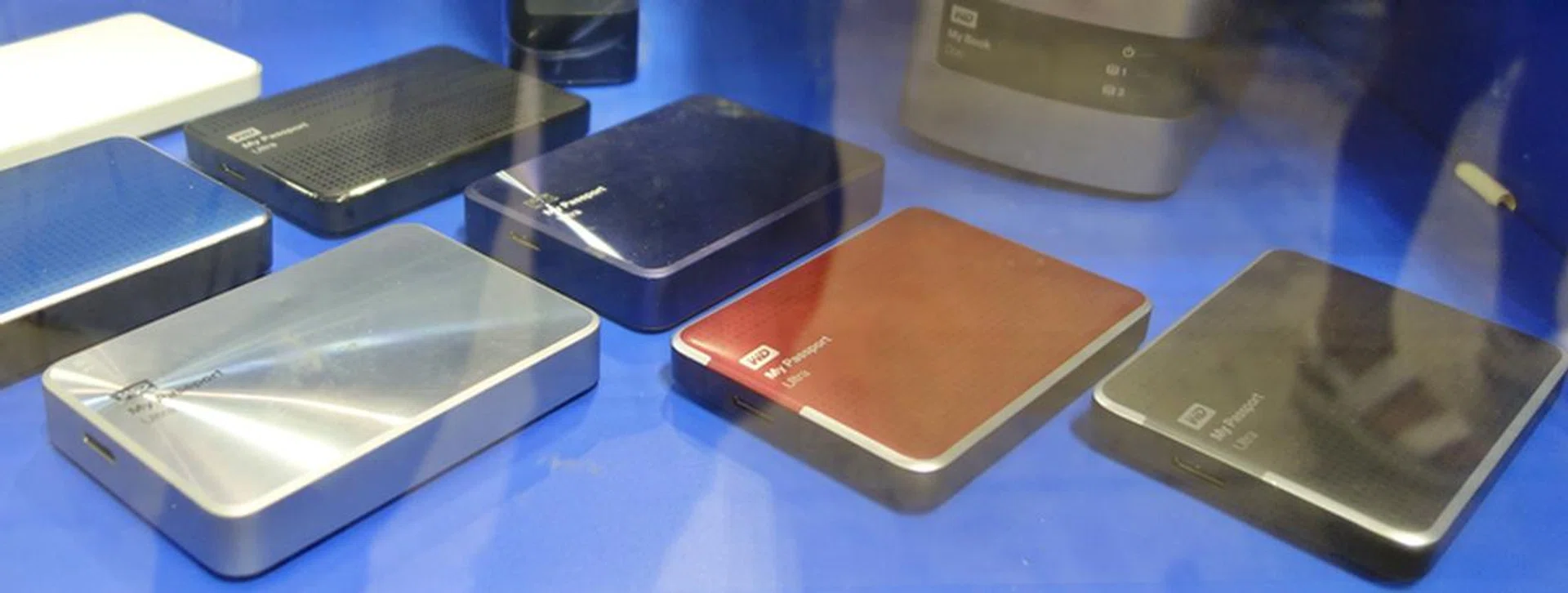 Shown here are the Western Digital My Passport Ultra portable 2.5" HDDs. The 2TB version (non-Metal edition) is for sale at S$159 and it comes with free gift bundle that comprises a 1-year data recovery service from Kroll Ontrack, a fabric carrying pouch and a Xelfie smartphone camera shutter. On the far left, we see the Metal edition drive of the series.