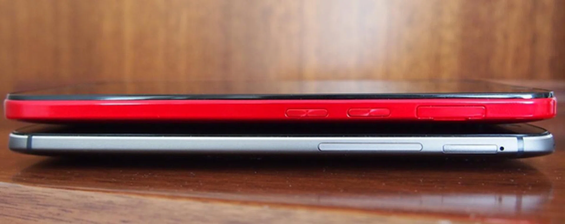 The volume controls are divided into two buttons on the HTC Butterfly 2 (top), which is different from the single strip on the HTC One (M8).
