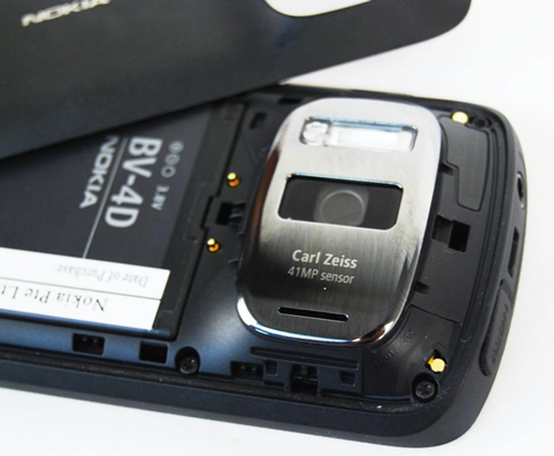 Having a larger sensor than the usual cameraphone means, more space required and a bigger body. As you can see from the back, the big camera bulge is flanked on the right by a large Xenon flash. Users have to remove the battery to insert your microSD or microSIM cards.