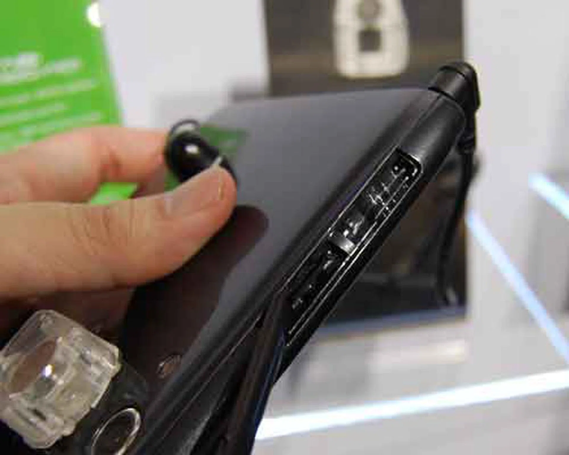 The microSD card slot (and a SIM card slot for the A101 / A501 variants) are hidden at the top, which requires you to pry open a plastic cover hiding it.