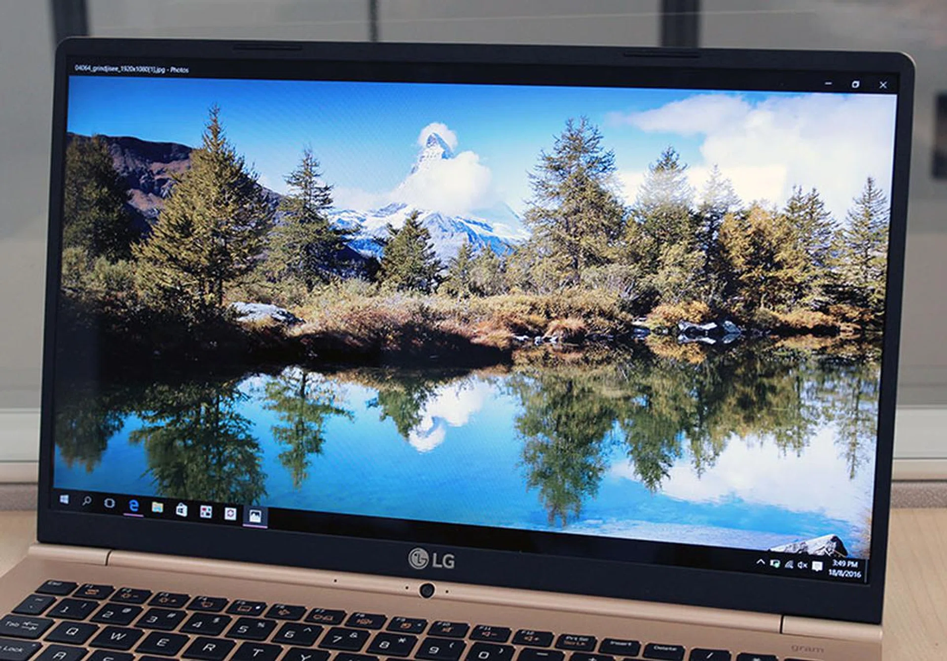 The Gram 15's display is sharp and crisp, but it's dim even at the highest brightness setting. Notice also the very thin bezel and the positioning of the webcam at the hinge.