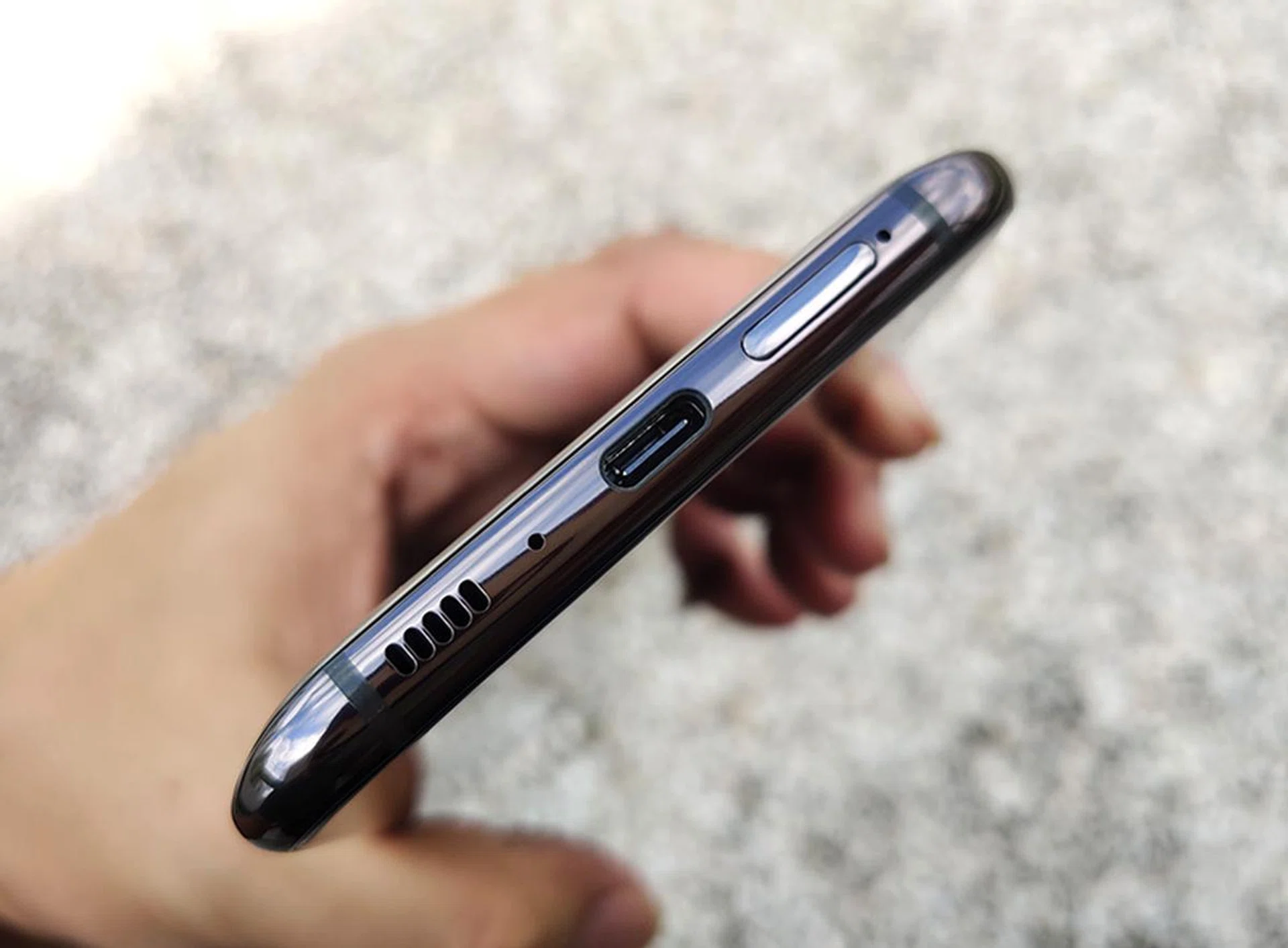 The Galaxy A80 charges via USB-C. It doesn't do wireless charging and it doesn't have a headphone jack.