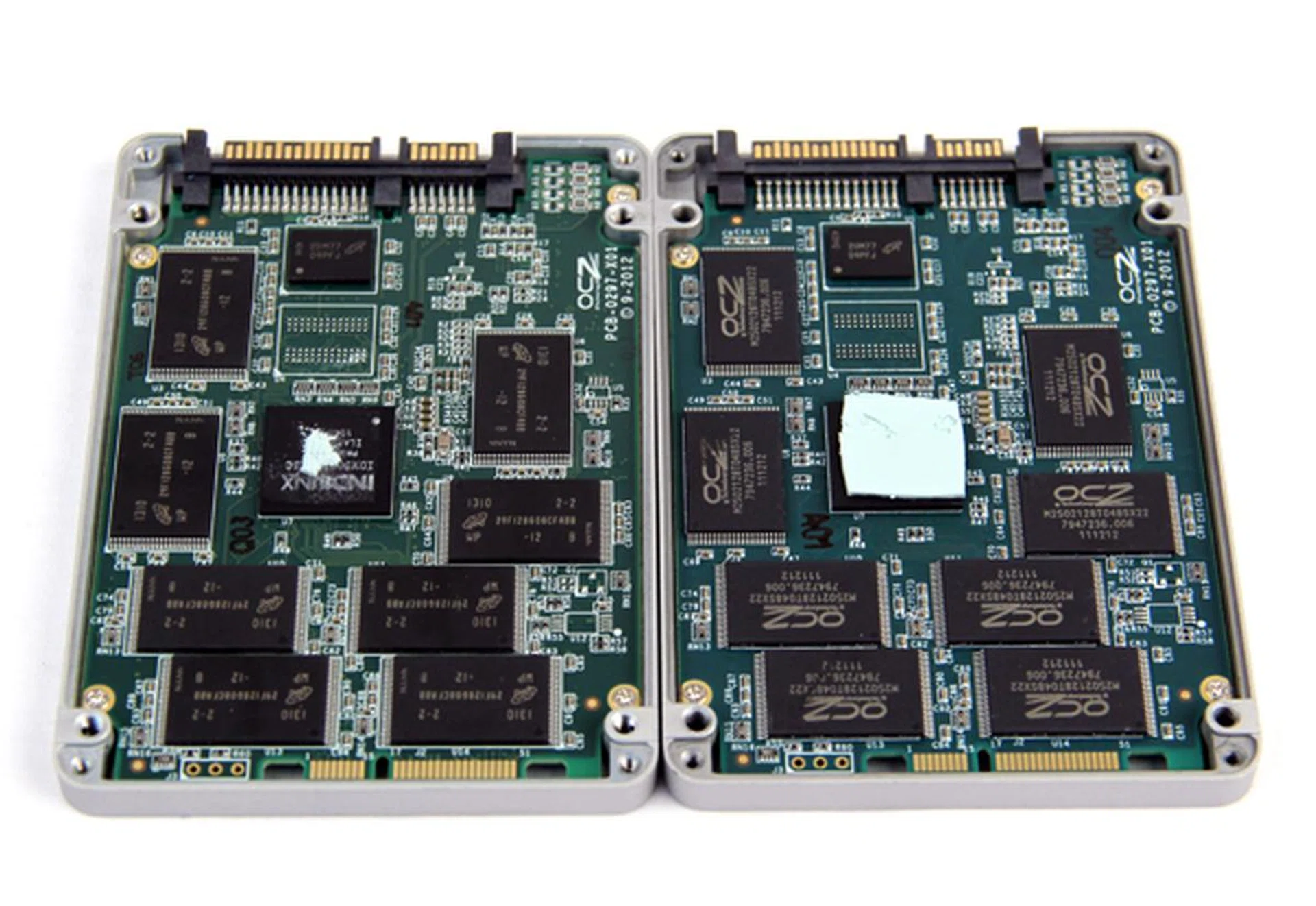 Peel the drives open and again, the two drives are very similar. The Vertex 450 is on the left. It can be differentiated by its Micron-branded NAND chips.