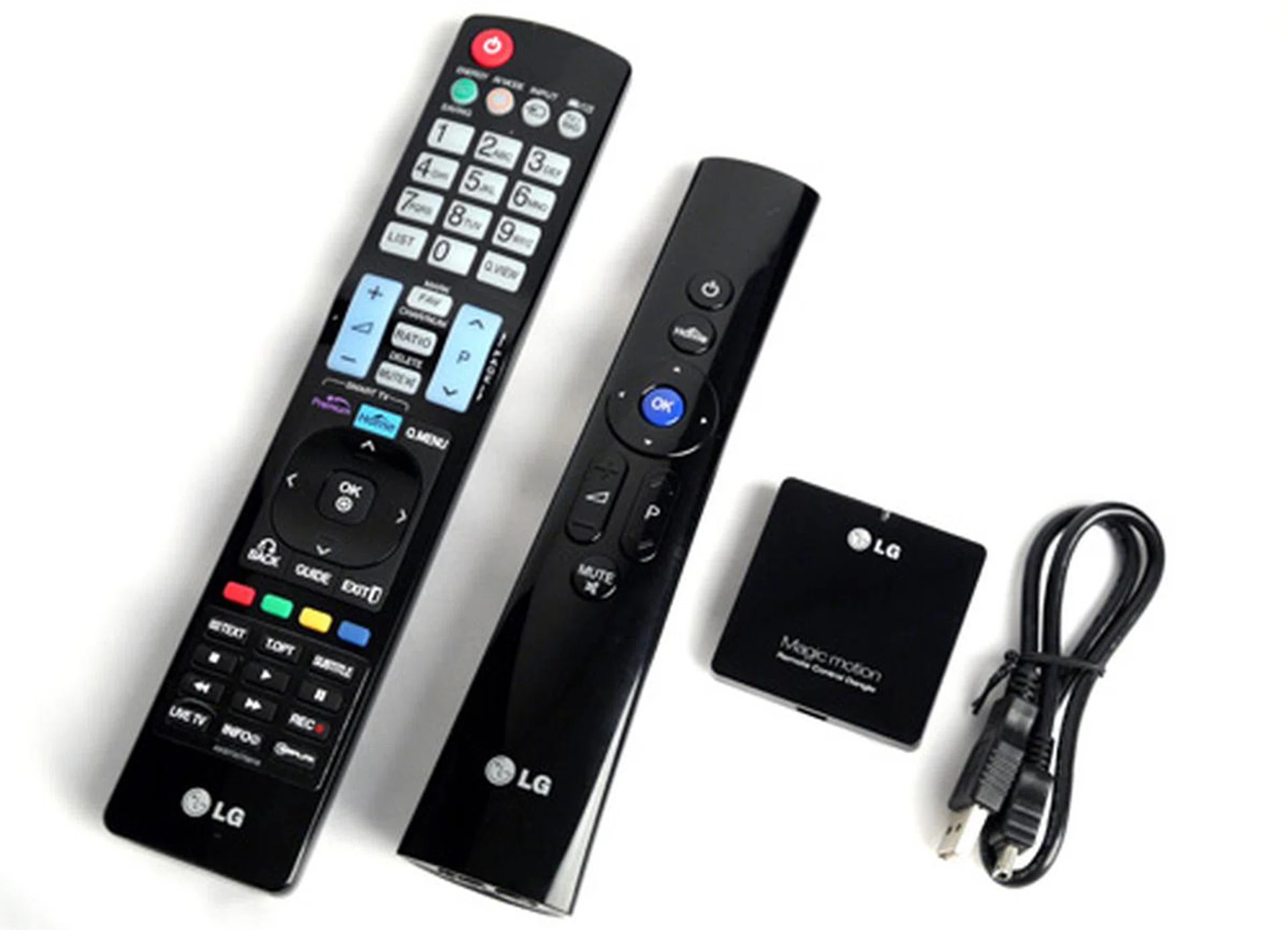 Shown here are the standard remote (left) and optional Magic Motion wand. That little square box is the Magic wand's dongle or receiver which requires a USB connection to the TV. The Magic pointing stick also comes with basic options such as a circular D-pad (when used as a regular remote), a Home button and volume controls.