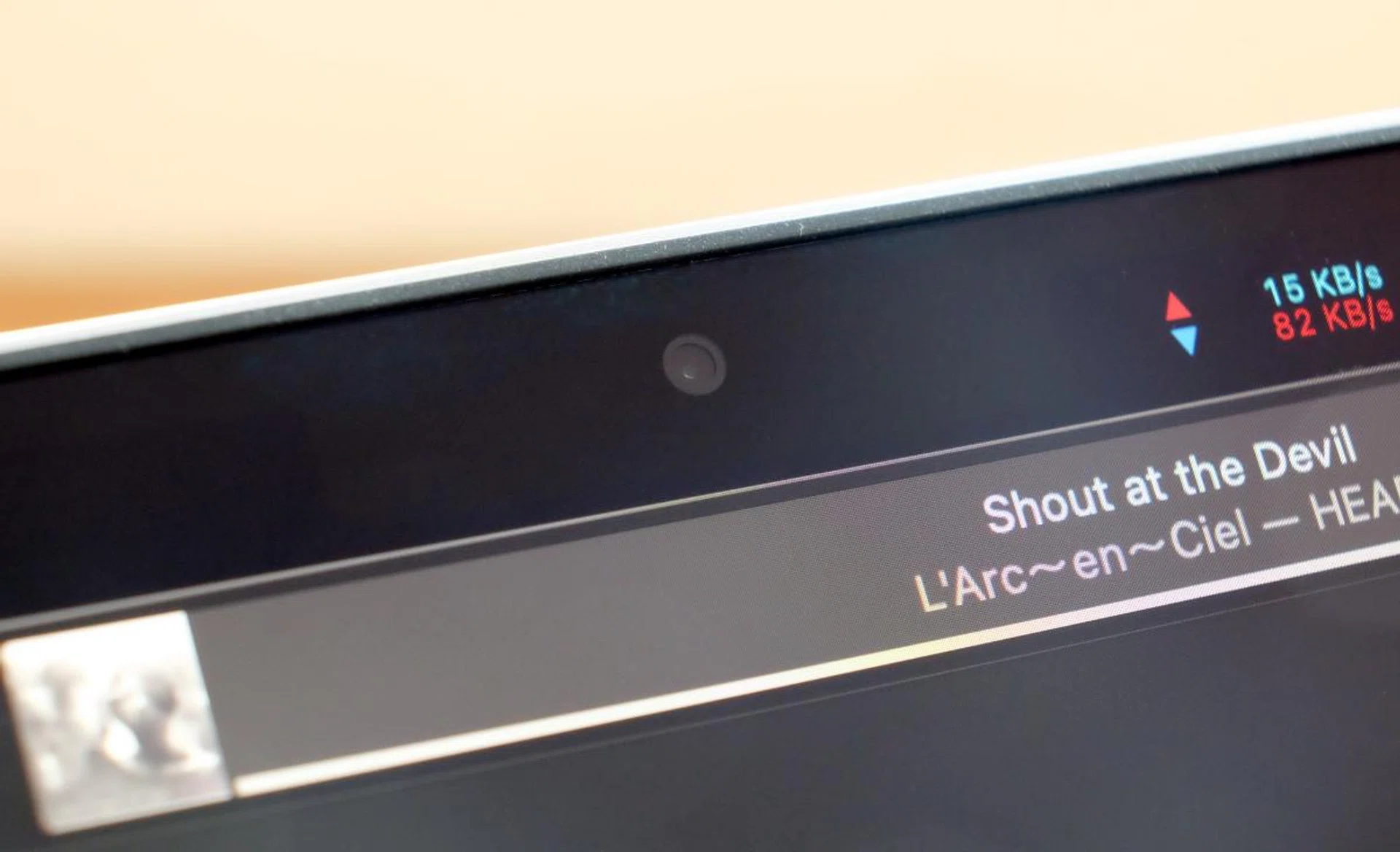 Use a dark wallpaper and the notch disappears.