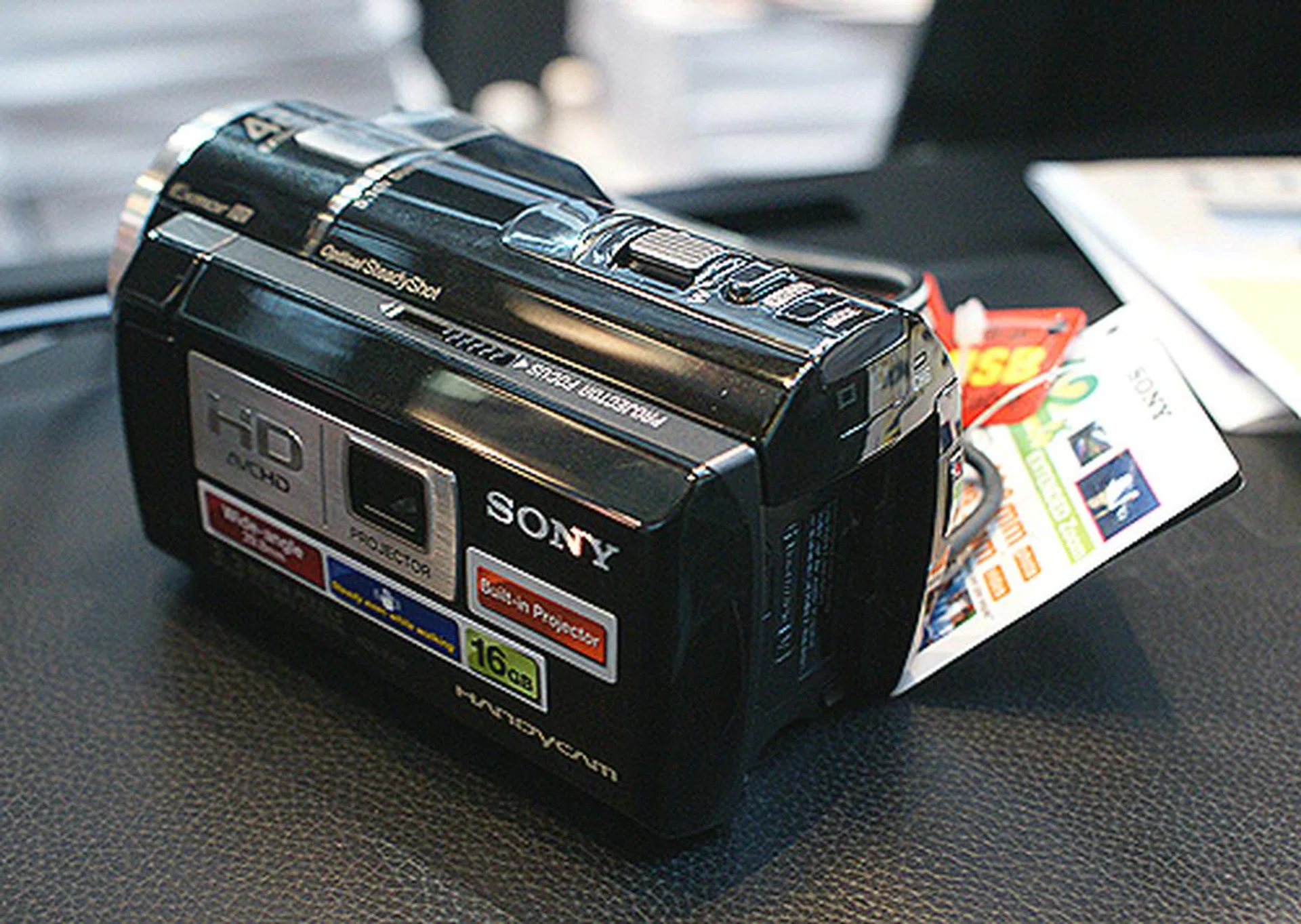 The Sony PJ10 records in full 1080p HD and has a built-in projector so that you can share your videos instantly. $1299 and includes free carrying case and battery, 16GB memory stick, 8GB SD card, tripod, DVD writer and training course.