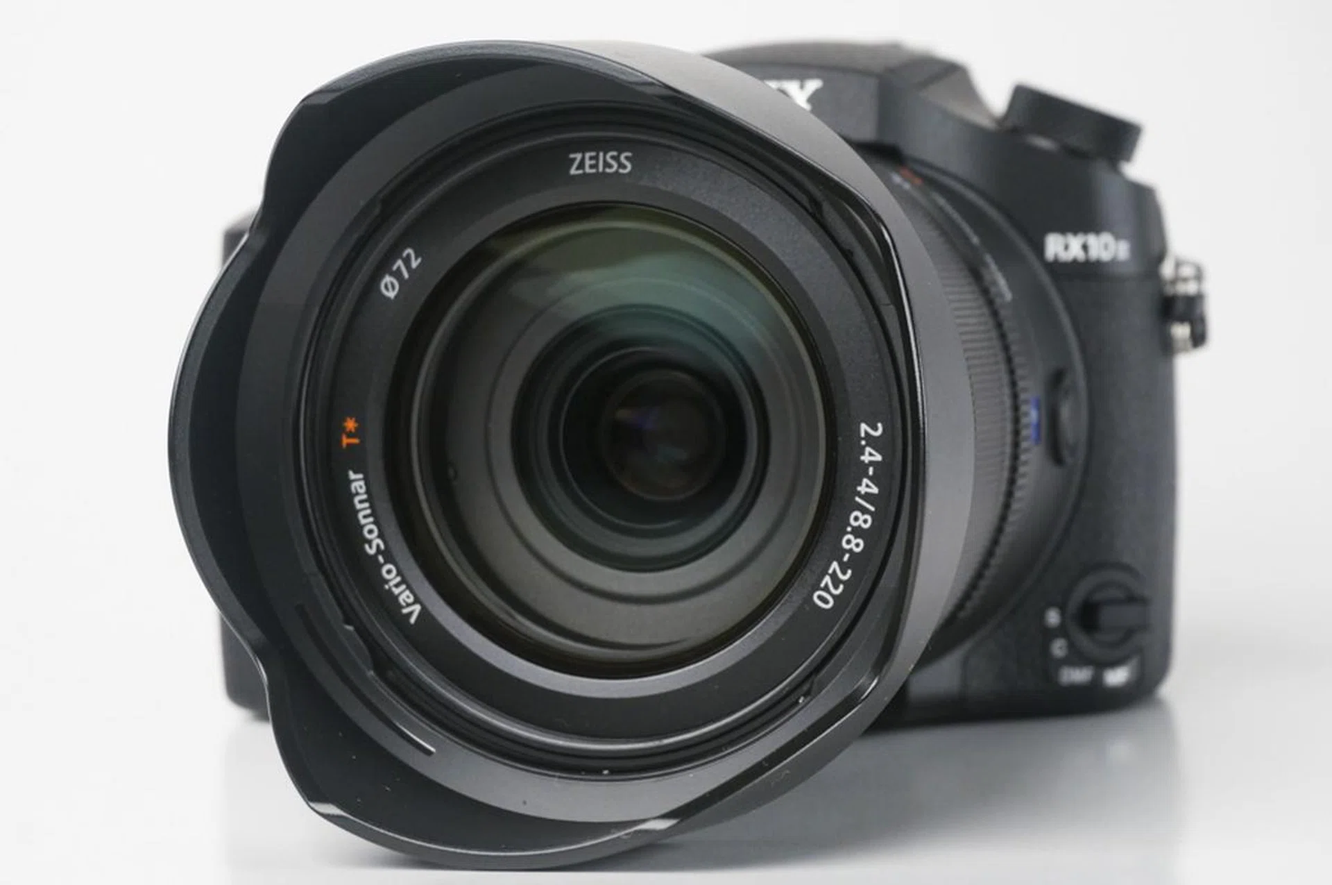 It's not a constant aperture lens, but f/4.4 at 600mm (35mm equivalent) certainly isn't anything to sneeze at either. 