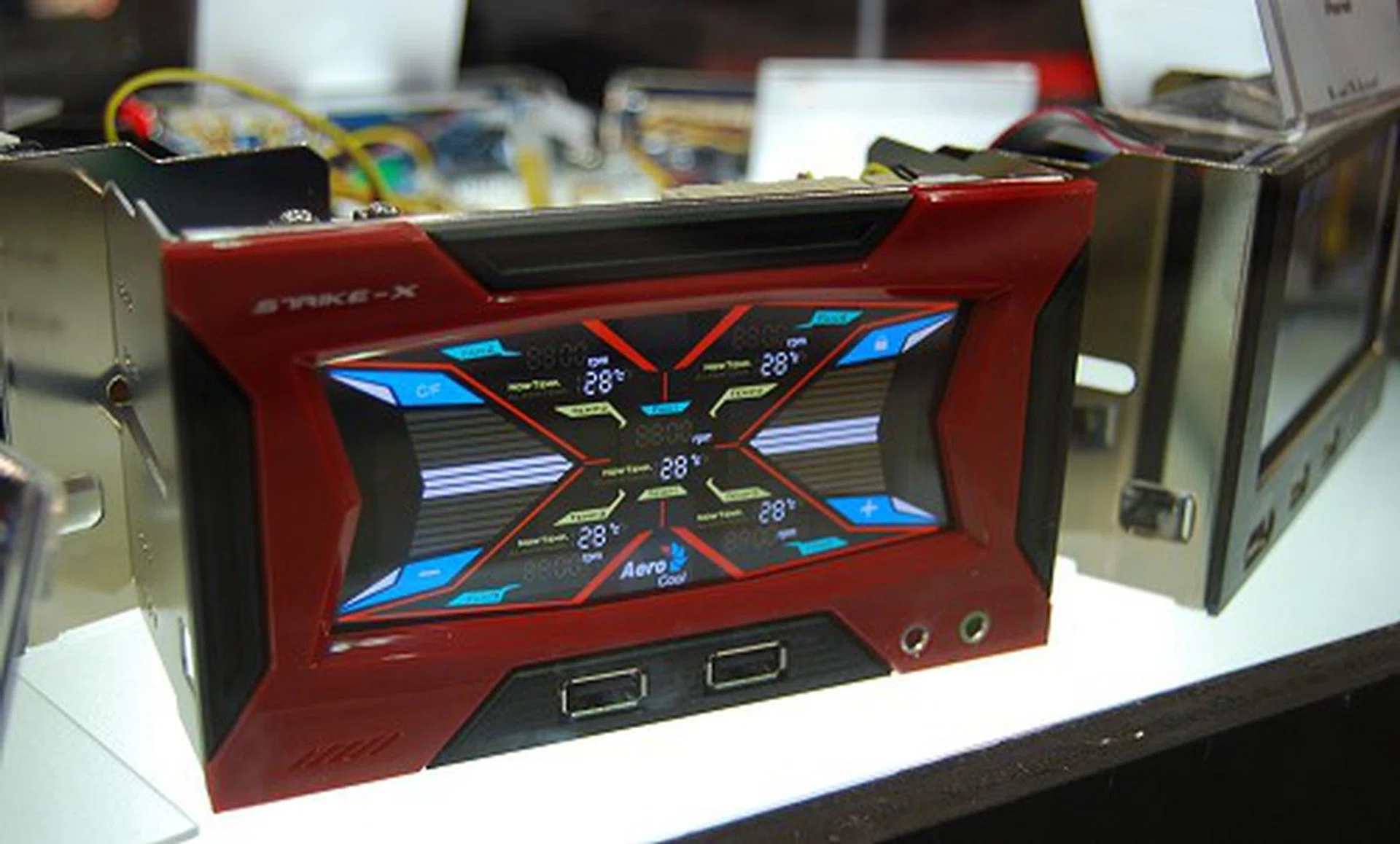 How about a fancy front-panel accessory to accompany the new casings? Also part of the Strike-X series, this dual-bay front panel device offers a touch-screen based interaction to monitor and control fan speeds, temperatures, and has a few standard ports like USB and audio.