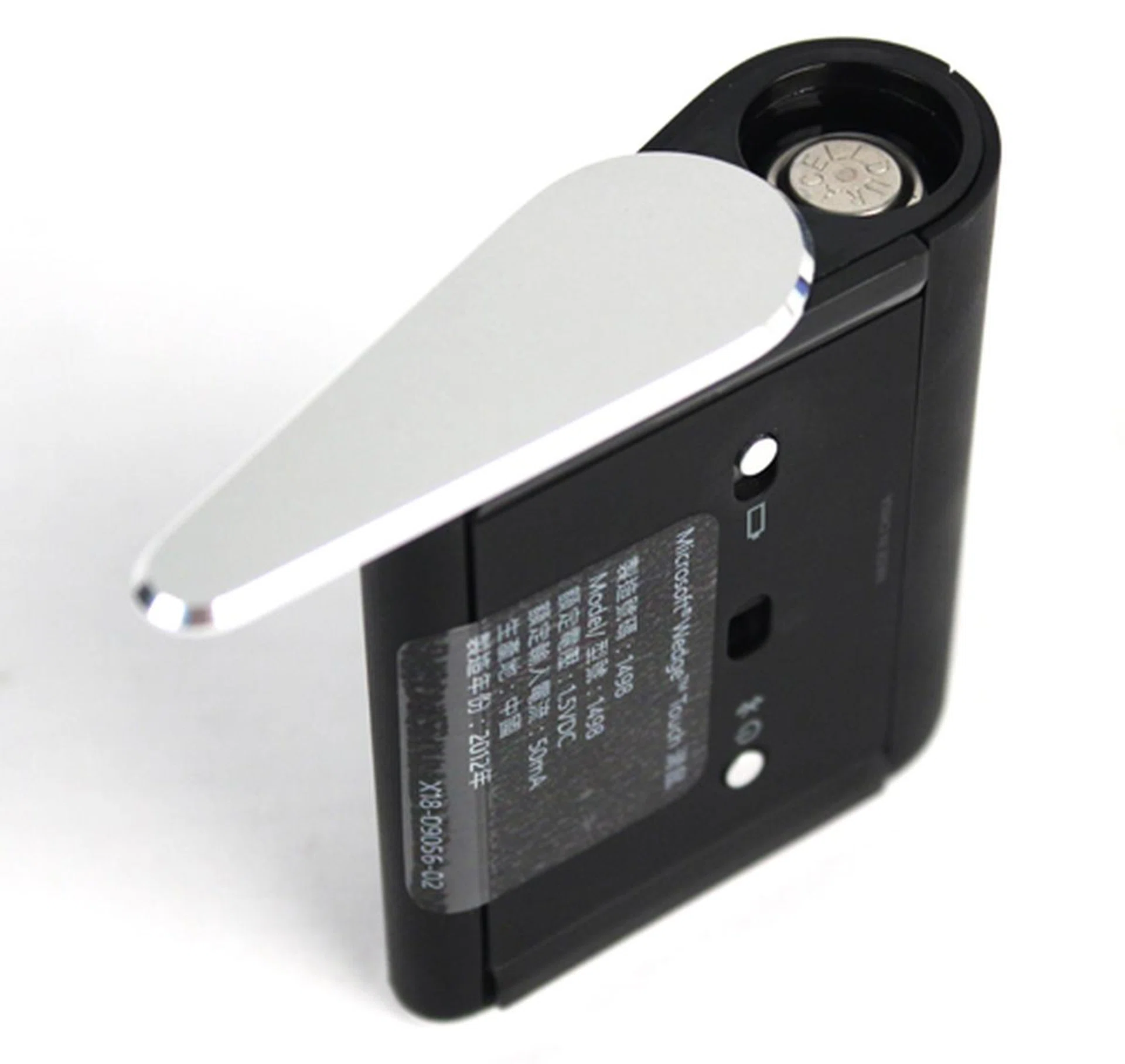 The Wedge Touch Mouse's side profile springs open to reveal the battery compartment. You can access this from the the small switch at the base of the device.