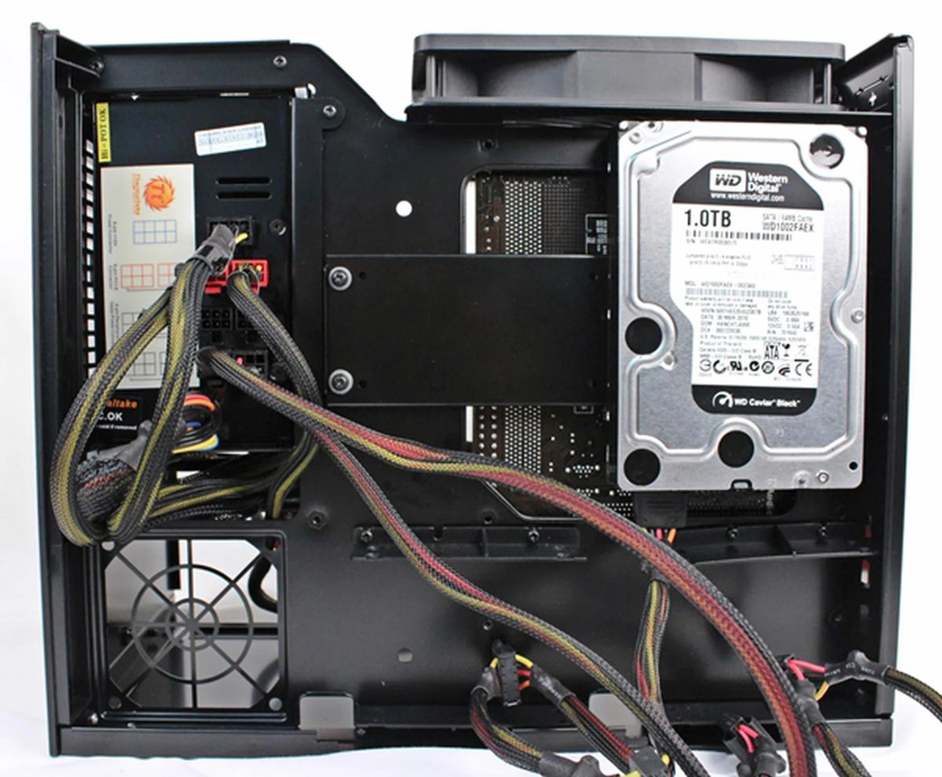 We had to fasten a total of eight mounting screws to get our lone 3.5-inch HDD in its place.