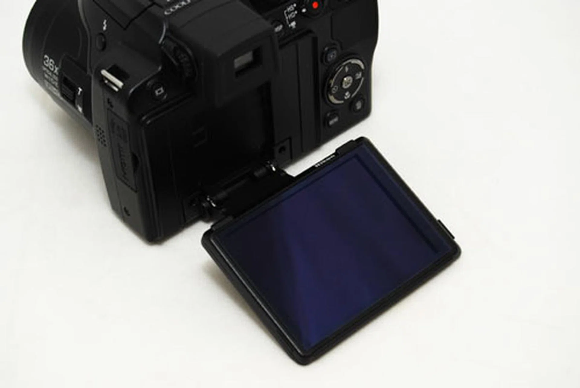 The LCD swivels from the bottom, so it gives you more freedom to shoot vertically, but not as much 360 degrees of freedom compared to if it swiveled from the side instead.