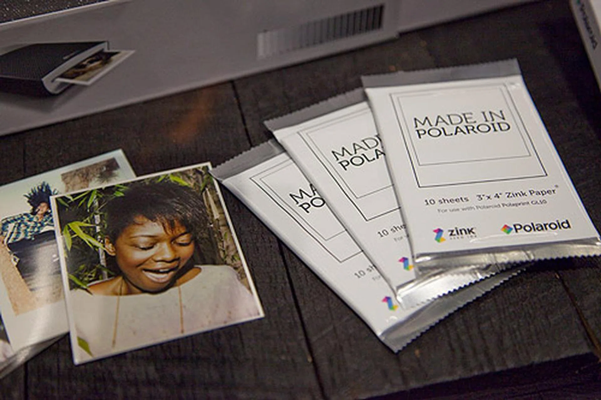 The Polaroid ZINK Paper with sample printouts. You only need to purchase the ZINK Paper for printing since the color dye crystals are already embedded in the paper. This removes the need for ink cartridges.