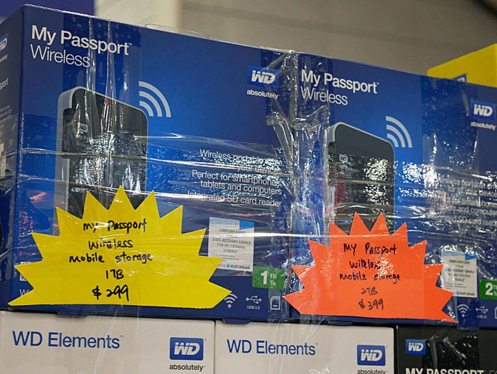 The My Passport Wireless is a portable HDD with built-in Wi-Fi that lets you back up or transfer photos and videos from your smartphone or tablet. There's also a built-in SD card slot so you can transfer files from your SD card without a PC. The 1TB version goes for $299 and the 2TB version goes for $399.