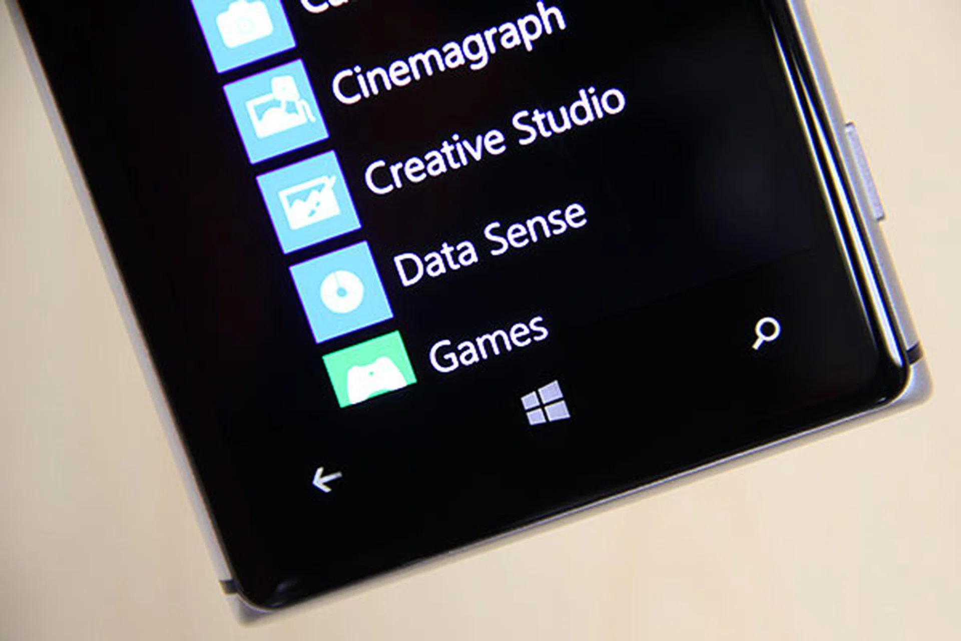 Towards the bottom of the screen sit three capacitive buttons for Back, Home, and Search functions. You can't see it here, but along at the bottom edge of the screen, there's a pinhole that hides the main microphone.