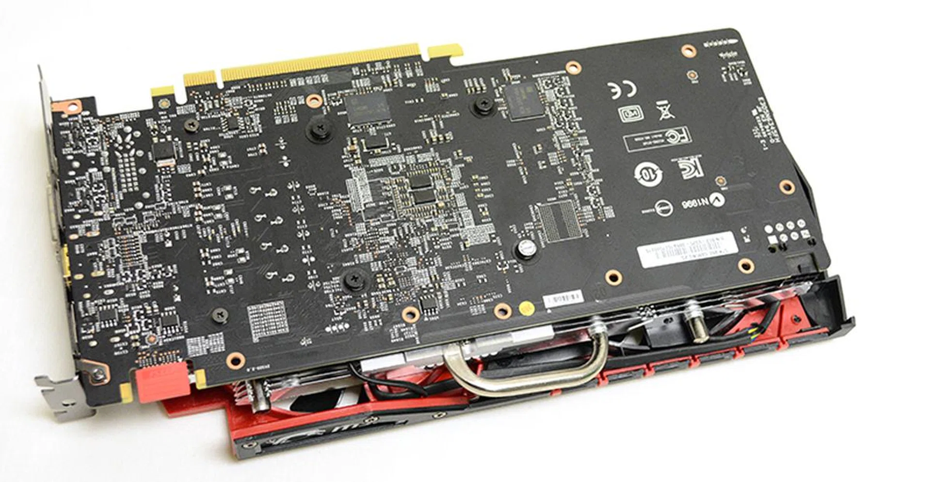 The card lacks a backplate despite its relatively large size compared to the ASUS and Gigabyte card. As you can see, the PCB is also longer as it spans the entire length of the cooling shroud.