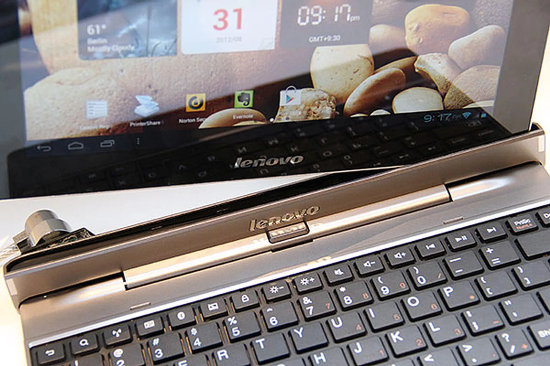 From what we've seen, the keyboard's docking mechanism holds the tablet pretty securely. To detach, just press the button below the Lenovo logo and pull the tablet.