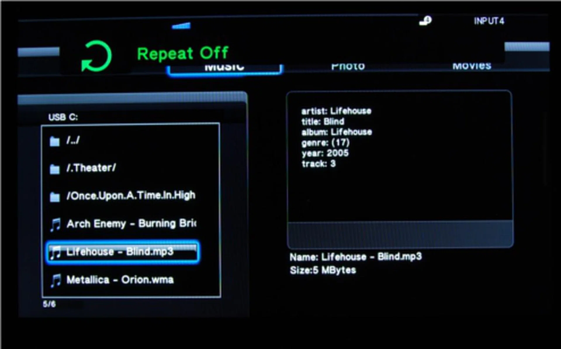 So that's where the repeat option was - on the remote. You can see the option toggled on/off visibly onscreen with the remote, but you won't find it in the playback options within the player's menu.
