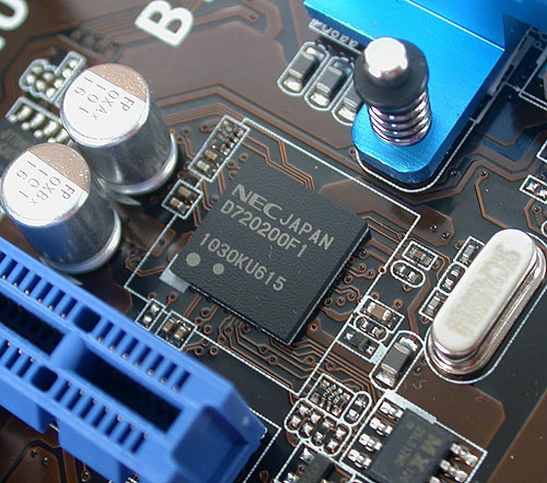 There are two such NEC 3.0 controllers onboard, giving this board a potential four USB 3.0 ports. Of course, only two are at the rear, the other two are present as onboard headers and share bandwidth with the second PCIe 2.0 x16 slot.