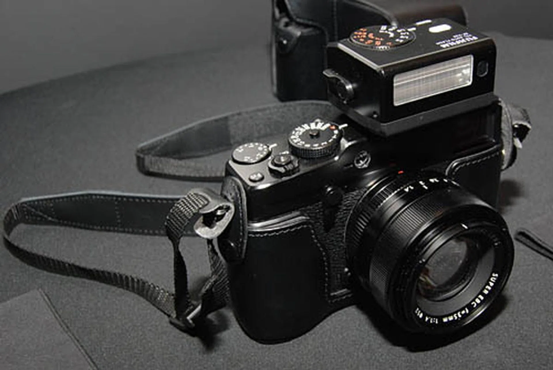 The shoe mount flash EF-X20, seen here mounted on the X-Pro1, will be sold separately. The X-Pro1 does not come with a built-in flash.