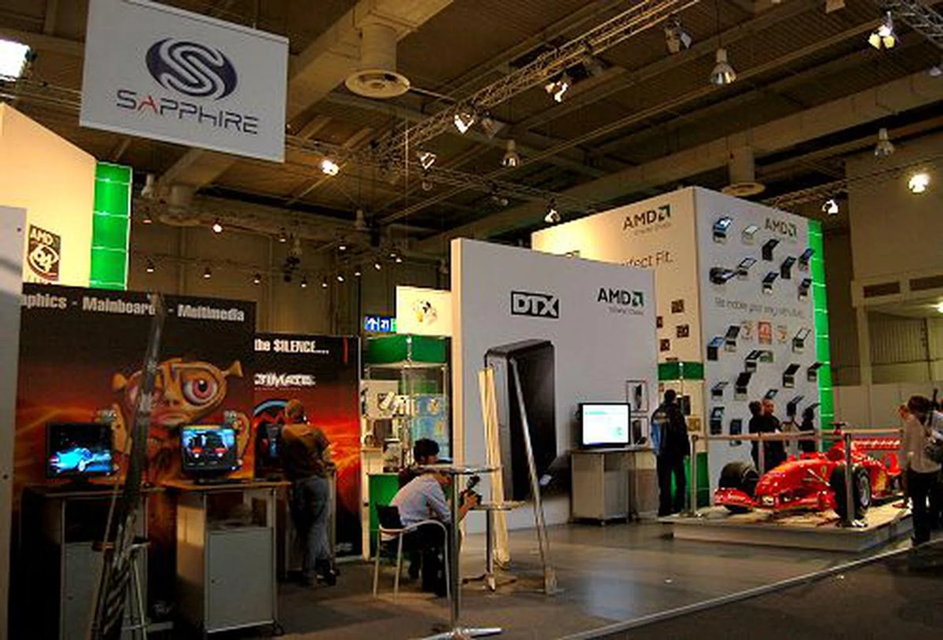  AMD's presence was strong this year, evident by a large number of partners (vendors) to jointly showcase a wider variety of products. Now that ATI is part of AMD, the union is helping to garner a wider target audience for its solutions (though their bottom-line hasn't gone up any - yet). A showcase of Turion 64 X2 notebooks, DTX (albeit it's just one case and nothing more) and a Formula F1 racing car can be seen in this photo shot.  