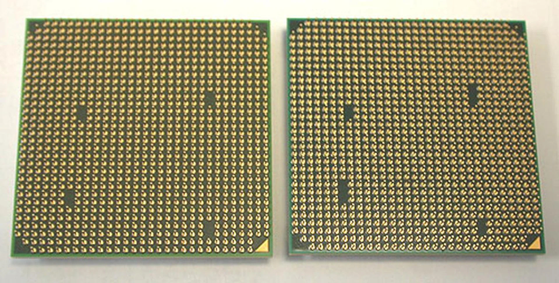 The only physical difference that we saw to distinguish between an AM2+ and an AM3 socket processor lies in the pins. Or rather the lack of. If you look closely enough, the AM3 CPU (on the right) has a larger gap of three pins at the 'holes', compared to two on the AM2+ version. 