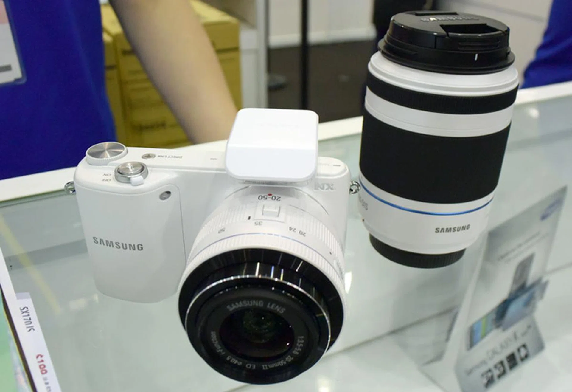 The Samsung NX 2000 features a 20.3MP APS-C CMOS sensor, 8fps continuous shooting, and a 3.7-inch WVGA touchscreen. The twin lens kit (20-50mm and 50-200mm) is going for $849 and freebies thrown in include an extra 16GB Memory card as well as a tripod.