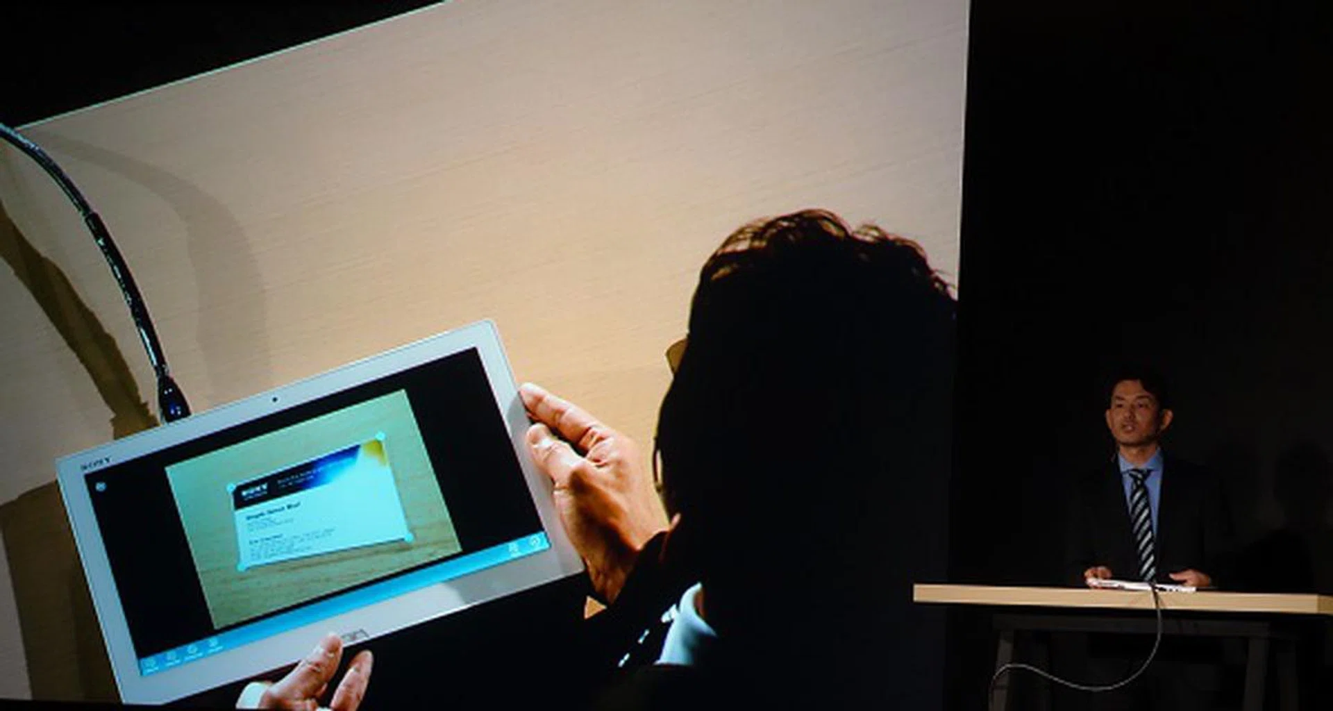 Shigeki Mori, General Manager of Planning at Sony's VAIO & Mobile Business Group, showing how the Duo 13 works with the bundled CamScanner app and the onboard 8MP Exmor RS camera to correctly capture a business card shot from an awkward angle, as well as eventually extracting key information from it via optical character recognition.