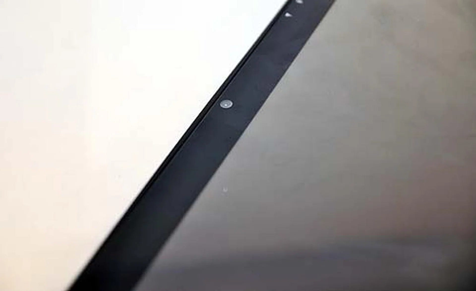 The glossy screen will attract plenty of fingerprints, especially since this is a device that you'll touch a lot. Note the front facing 1.3-megapixel camera.