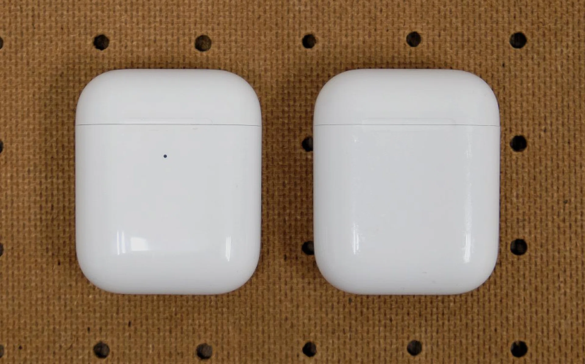 New wireless charging case on the left. It's distinguishable by the LED status indicator on the outside versus the previous version on the right.