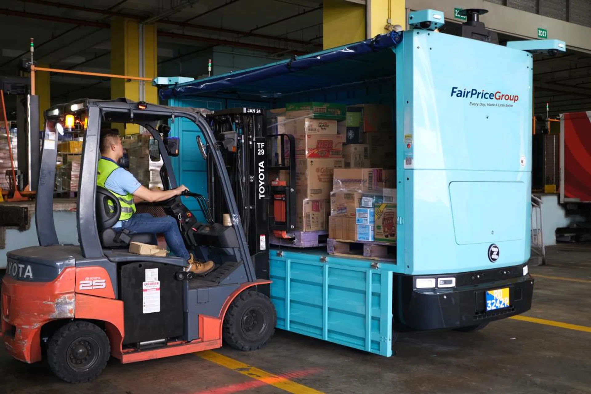Loading goods onto the Zelos Z10 at Fairprice Group's Benoi distribution centre. Photo: Fairprice Group