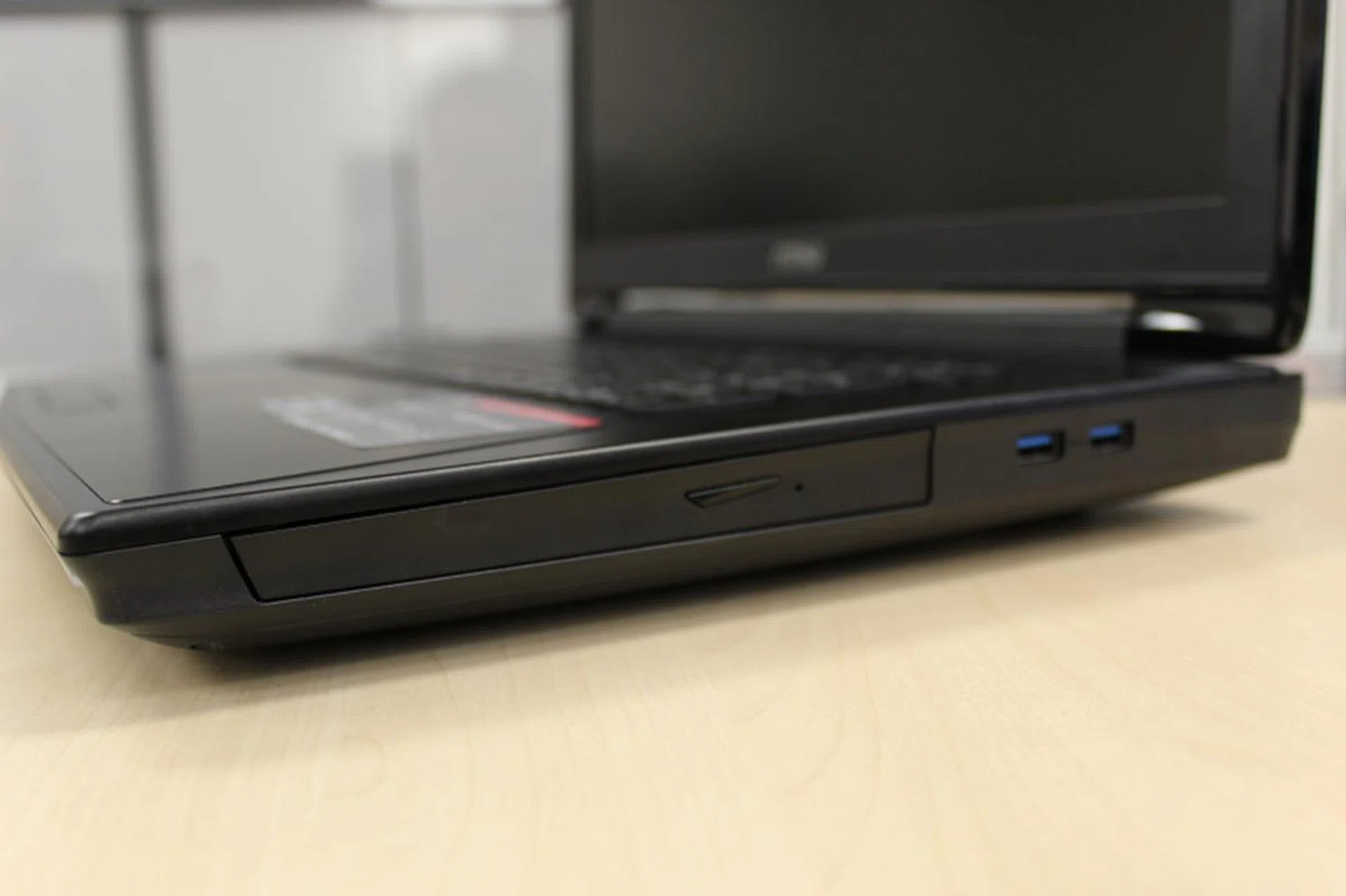 The right side contains the optical drive and two more USB ports.